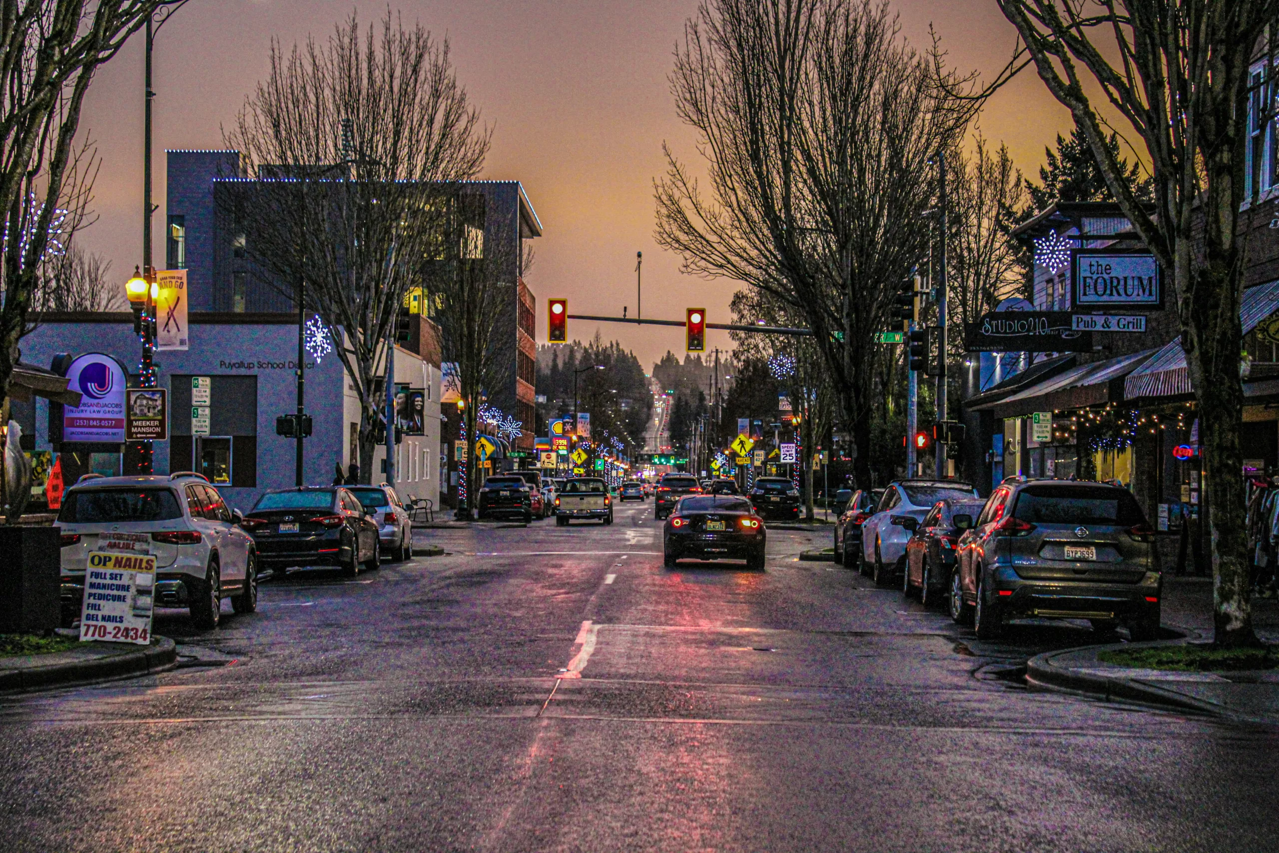 A city filled with traffic next to tall buildings Puyallup, WA