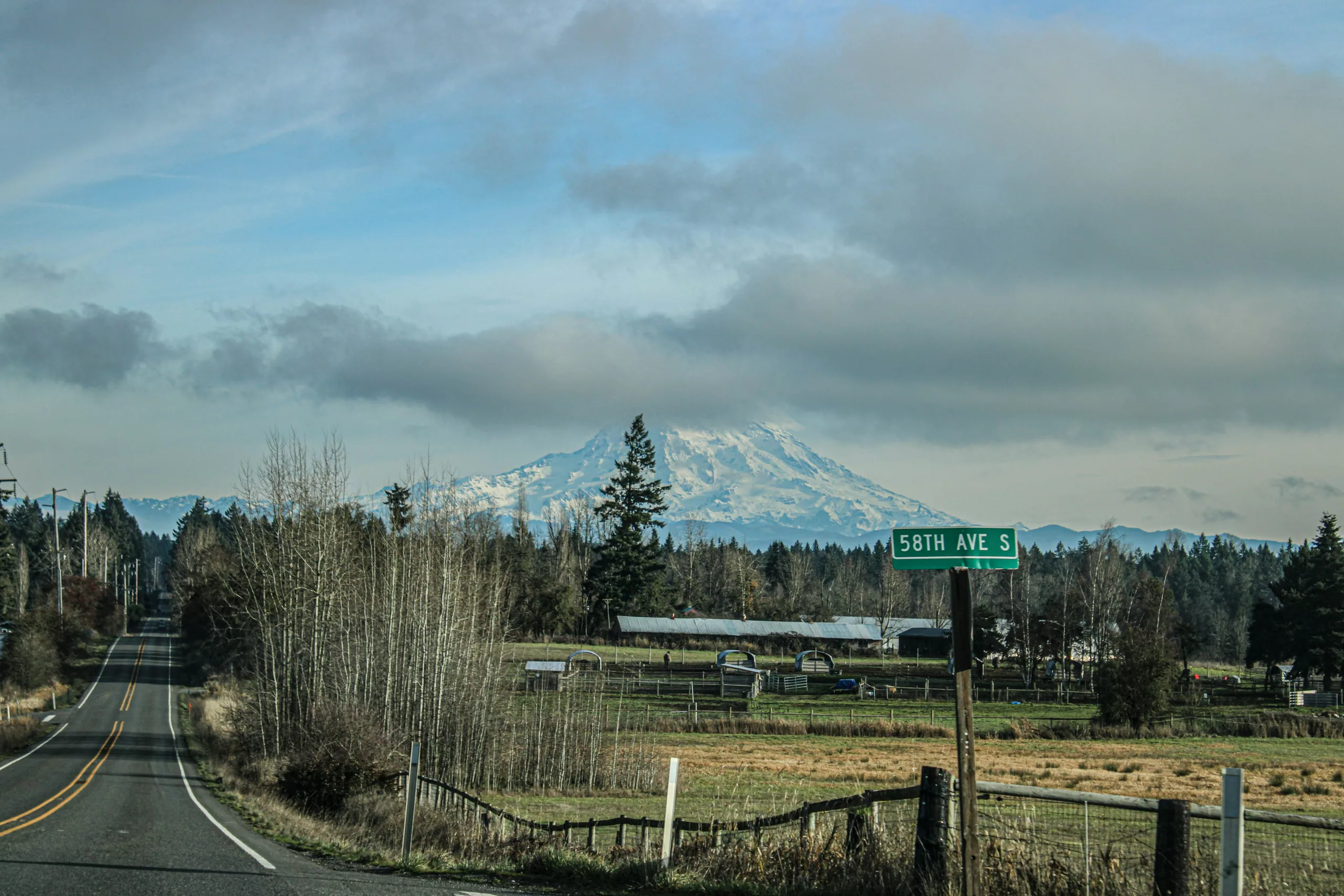 A long road with a mountain in the background McKenna, WA