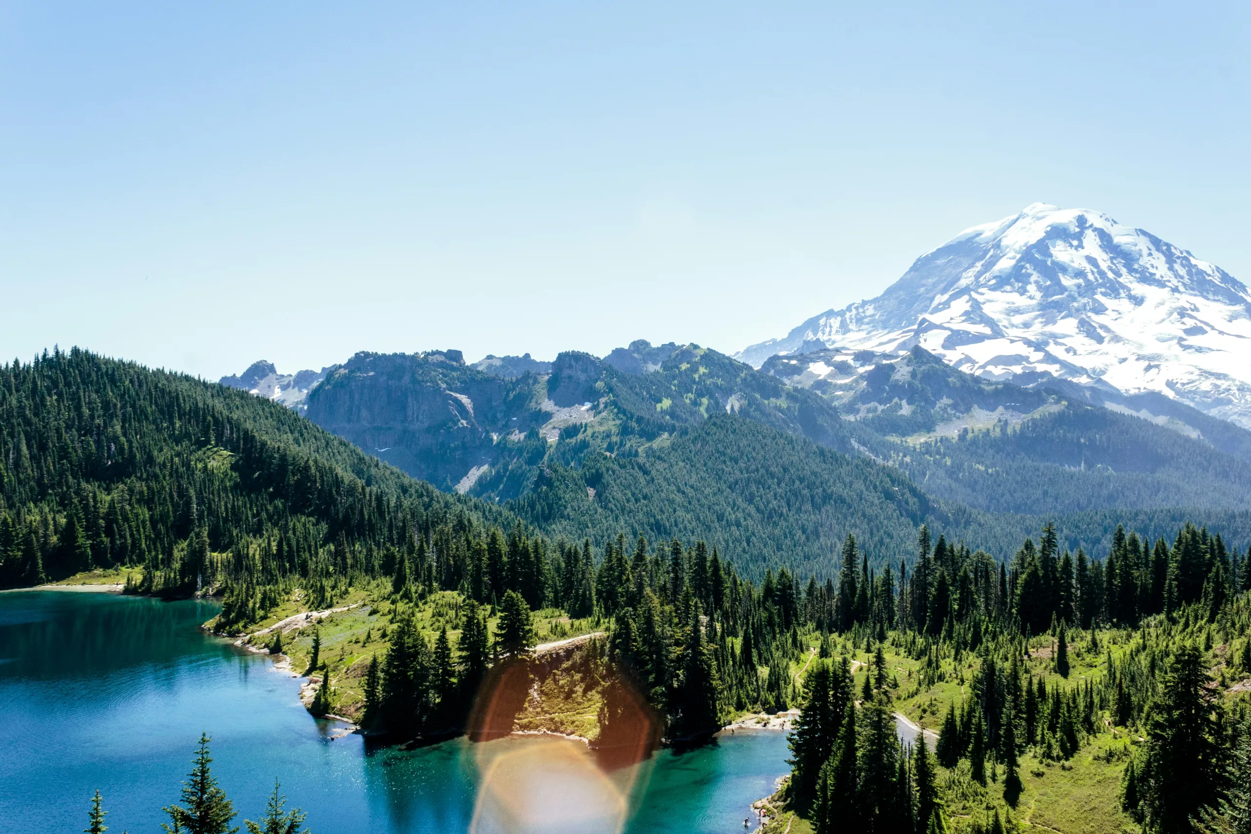 A water lake in the middle of the trees with mountain background Enumclaw, WA